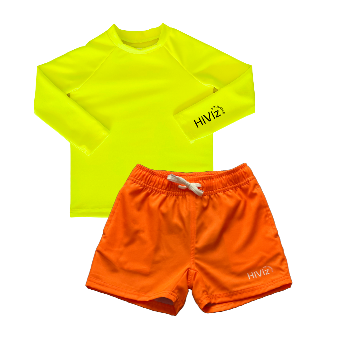 Image of a neon swimwear set on white background. A long-sleeve neon yellow rash guard and a pair of neon orange swim trunks.